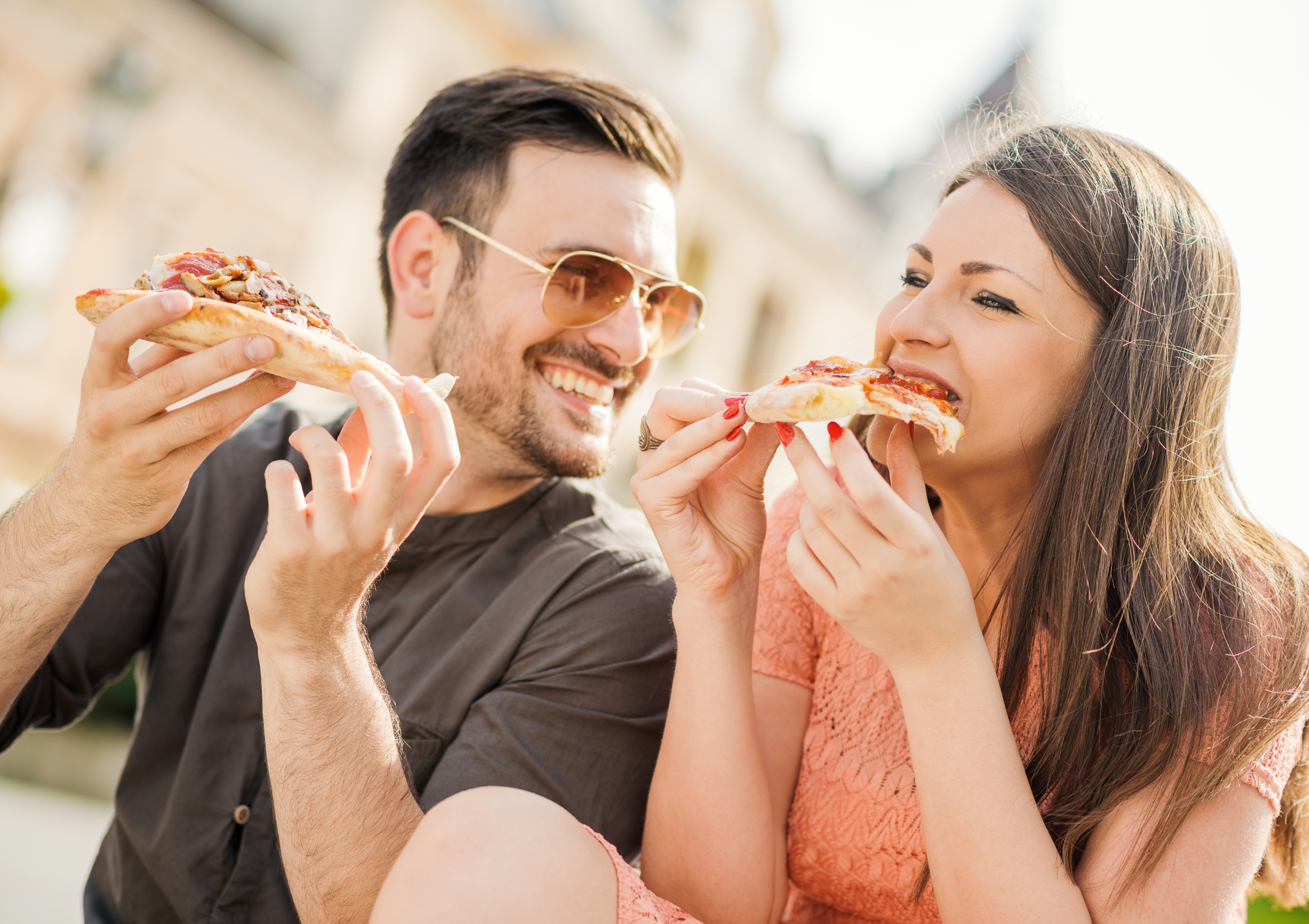 Happy customers with pizza